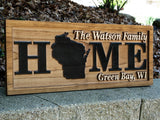 Home with State Family Name sign